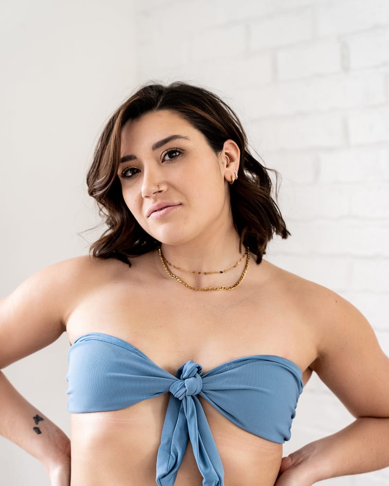 Front of a model wearing a size XL Ribbed Front Knot Bandeau Bikini Top in Black by Gold Elite Apparel. | dia_product_style_image_id:288247